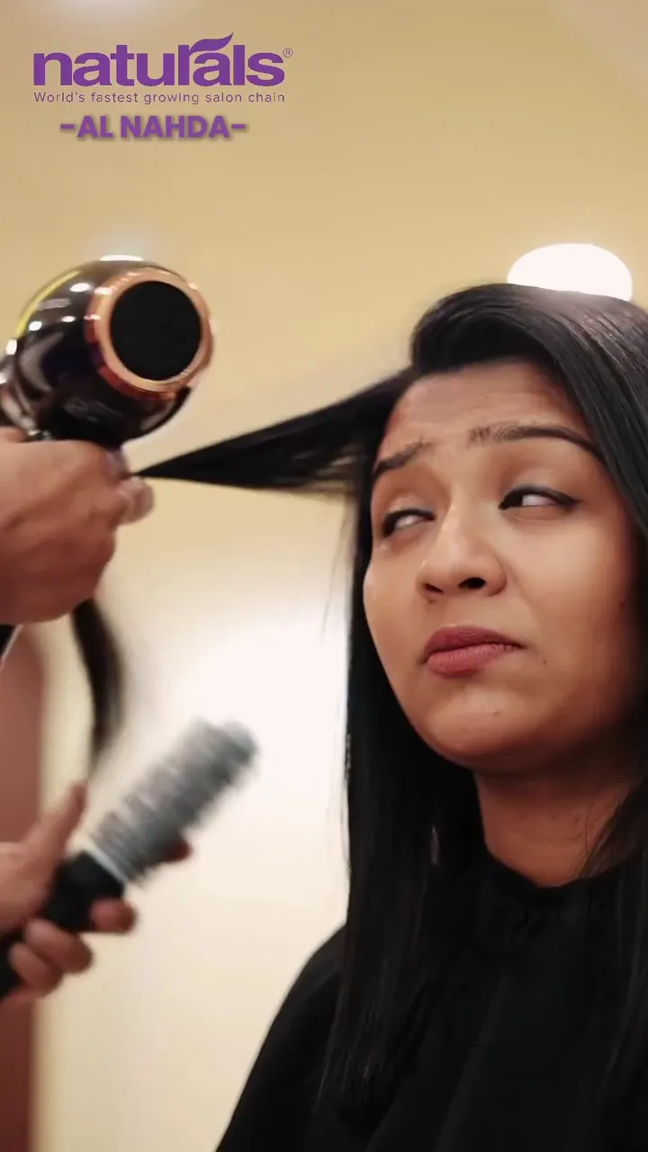 A client getting a blow-dry at Naturals Al Nahda